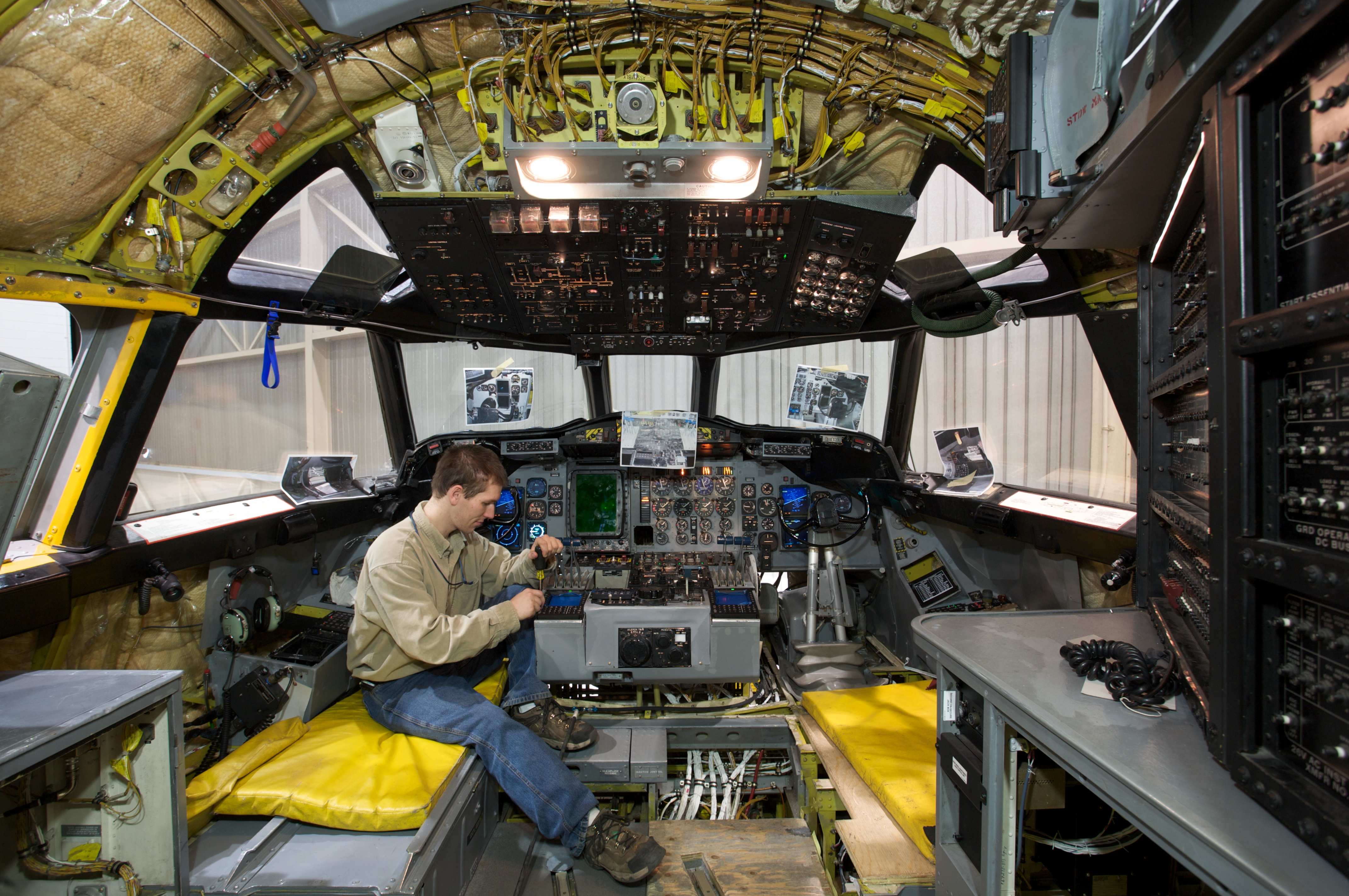 Aerospace Engineer working on the inside of an aircraft